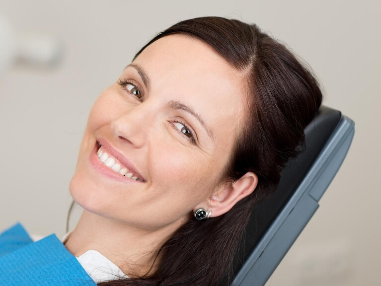 woman smiling in dental chair